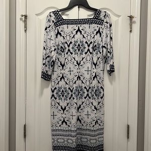 3/4 sleeve dress.  Back goes to a V.